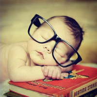 Sleeping baby in glasses